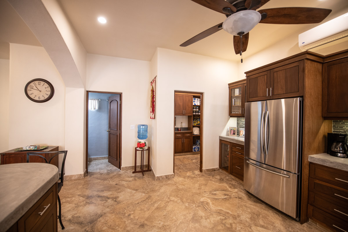 Fabulous One Level Home with Large Garage, Dipping Pool, Outdoor Kitchen and Bar Plus Guest House! Kitchen looking towards pantry and half bath